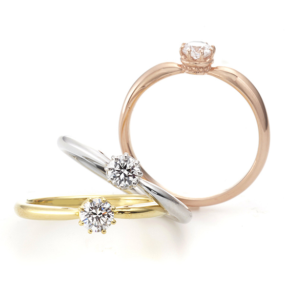 ダイヤモンドを支える爪を８本で仕上げ、丸みの印象を強くしたエンゲージリング。横から見ると、王冠のようなデザインがオシャレ。