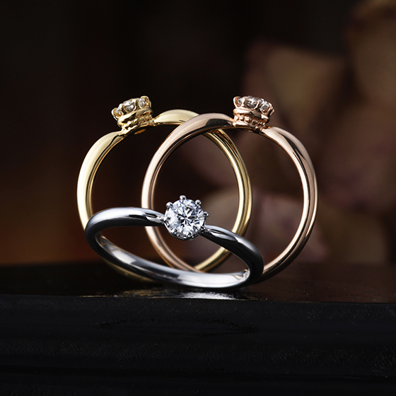 コロンと丸みを帯びた形状が可愛らしい婚約指輪。ダイヤモンドを支えるシャトン部分にはミル打ち加工が。クラウンの様なデザインが高級感を与えてくれます。